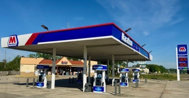 Marathon-branded gas station canopy and fuel pumps