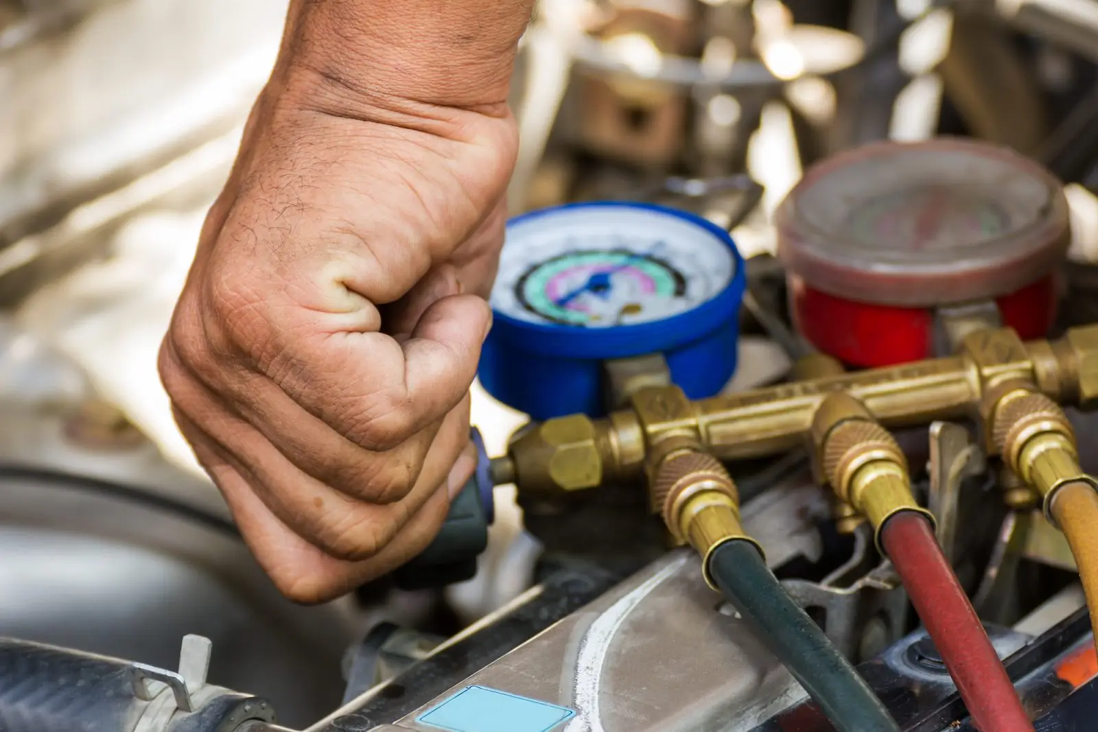 Operator checking fuel gauges on a bulk storage tank