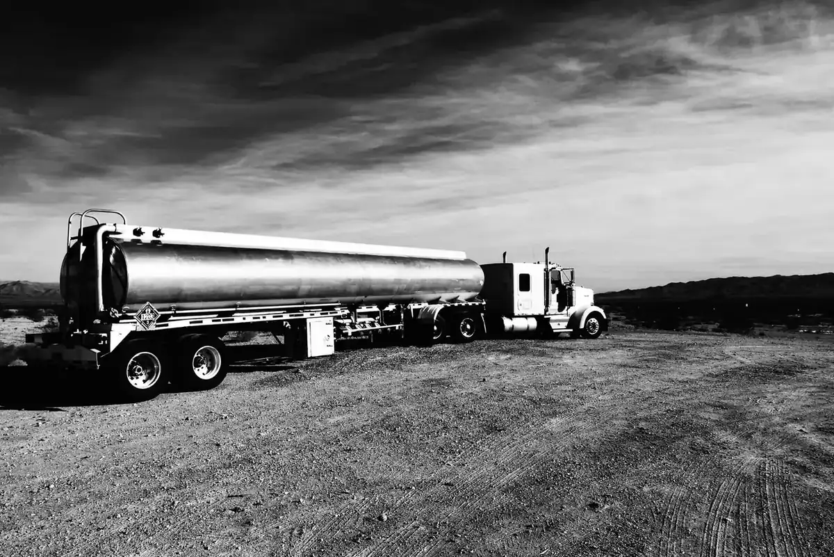 Bulk fuel tanker parked on an open field road
